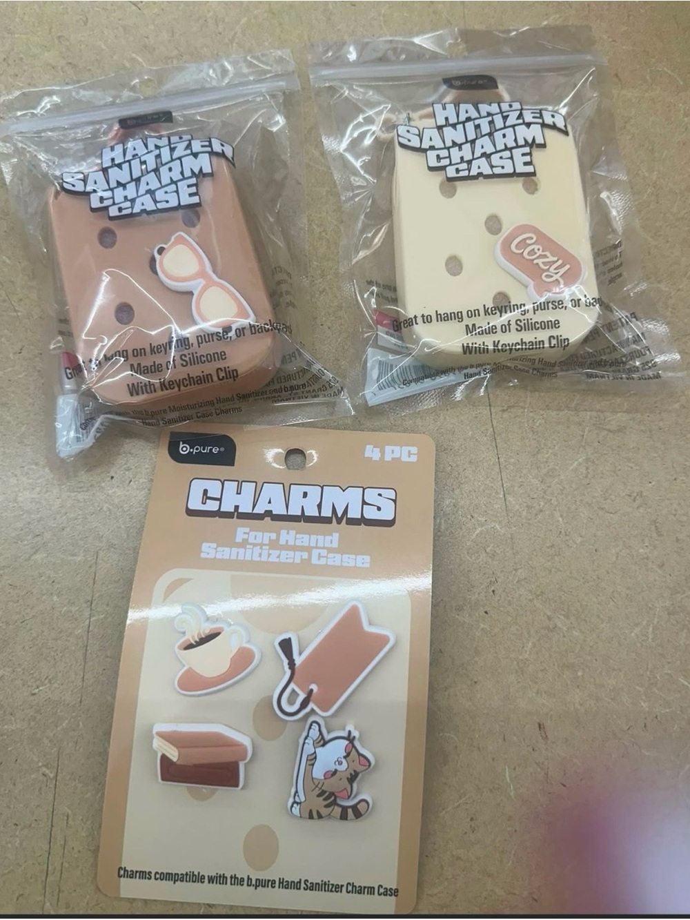 B.Pure Hand Sanitizer Charm Case with Tan and Cream Charms